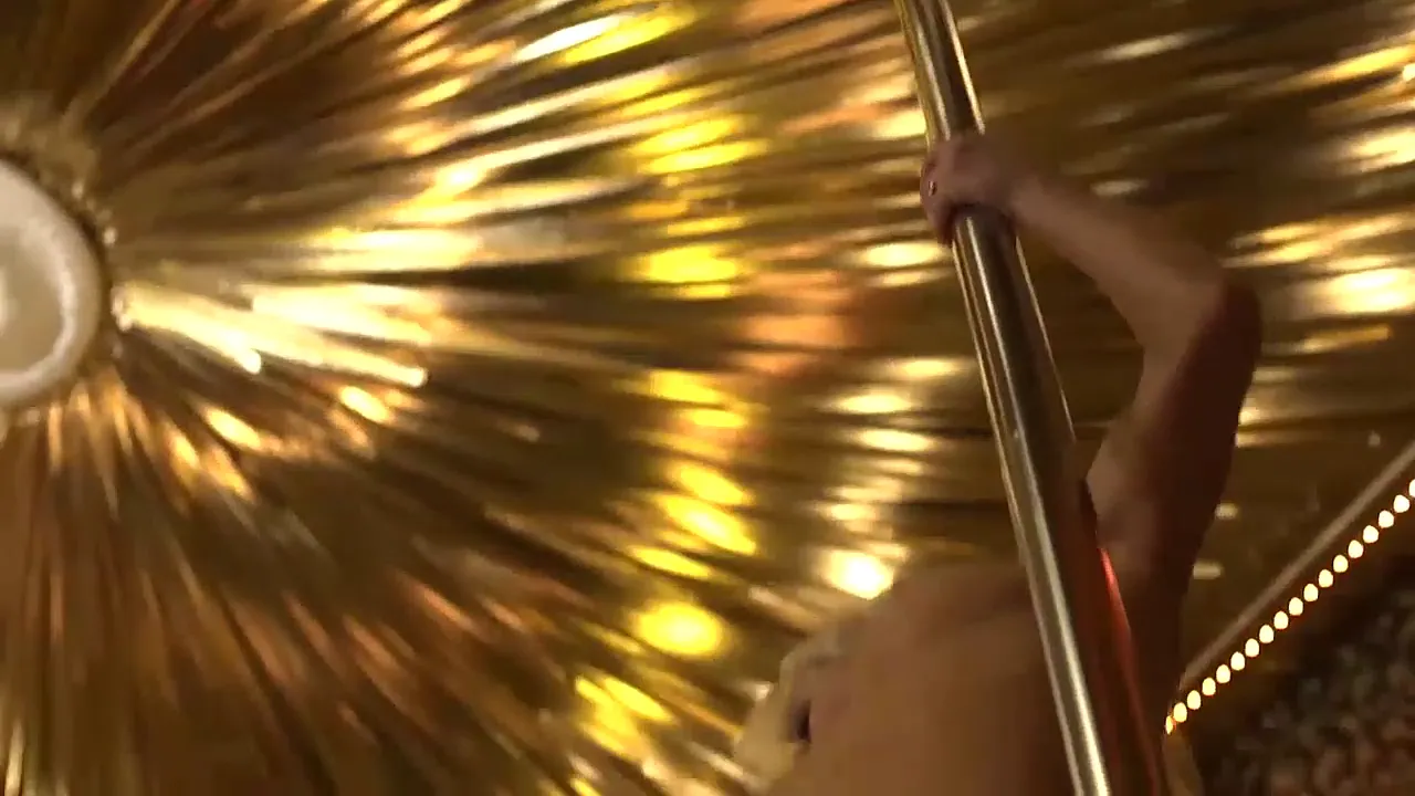 Mature stripper Mia Magma takes off her clothes on stage