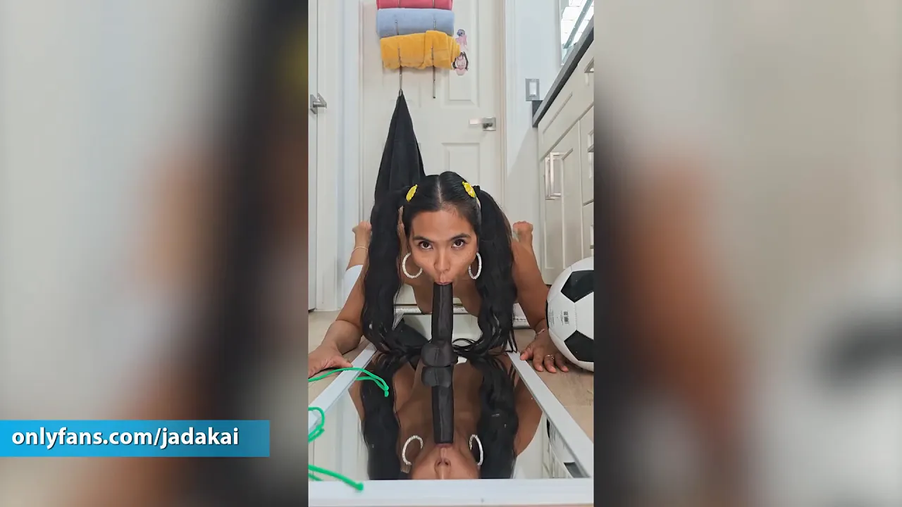Asian babe Jada Kai strips out of Brazil bikini and sucks her black dildo