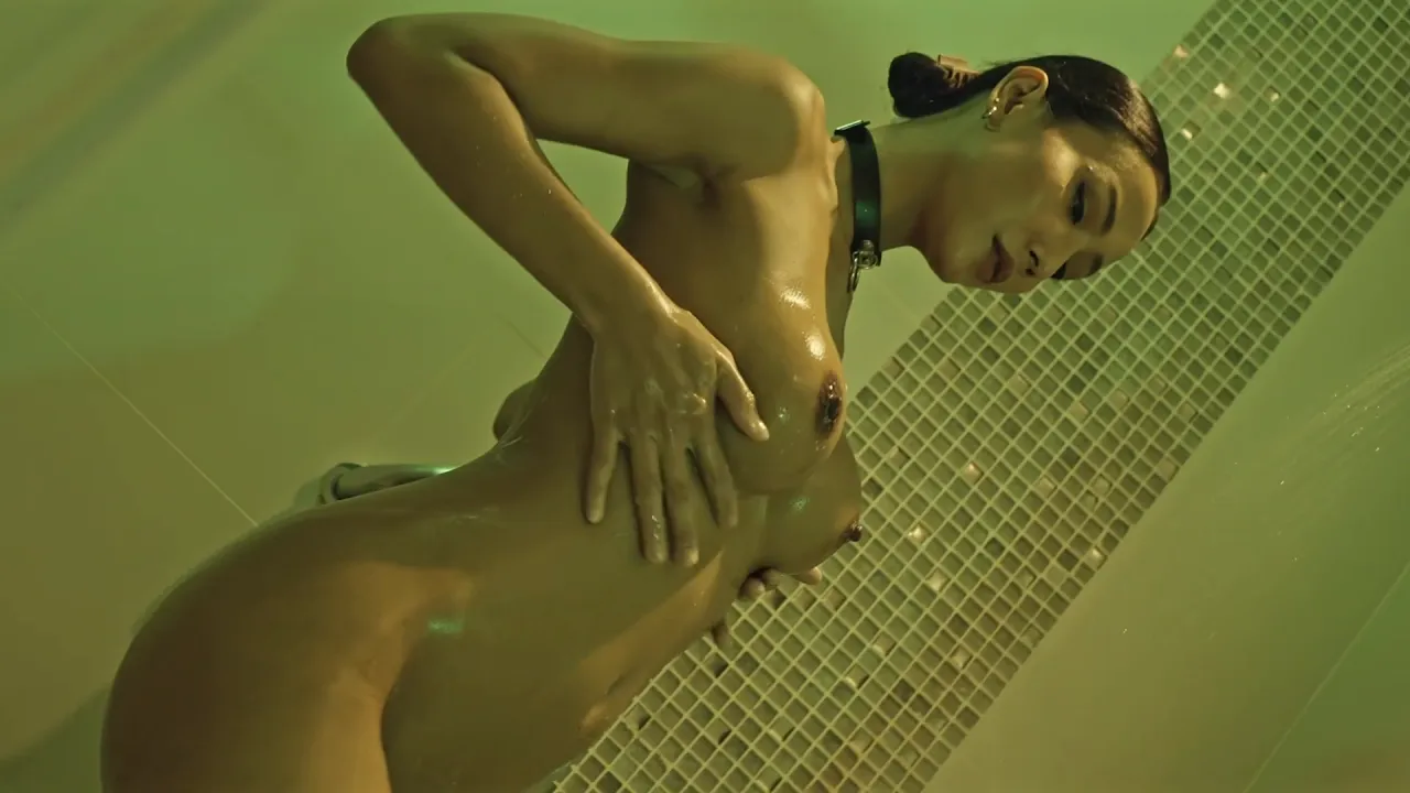 Submissive Asian MILF slave masturbates and has an orgasm to music
