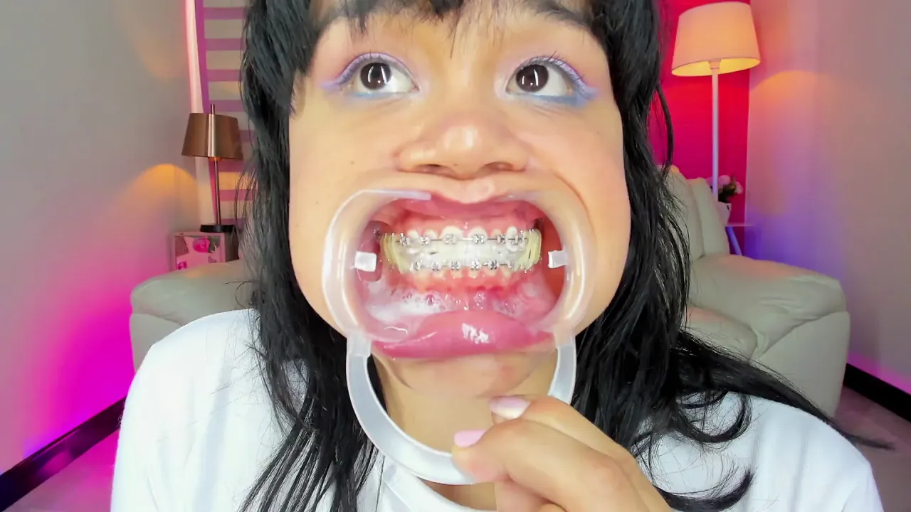 Lila Jordan strips solo on webcam, showing off her braces and suspenders
