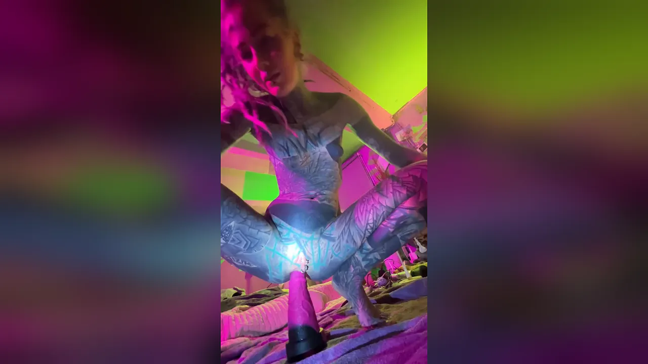 Tattooed solo girl struggles to take her small-titted ass on a long dildo