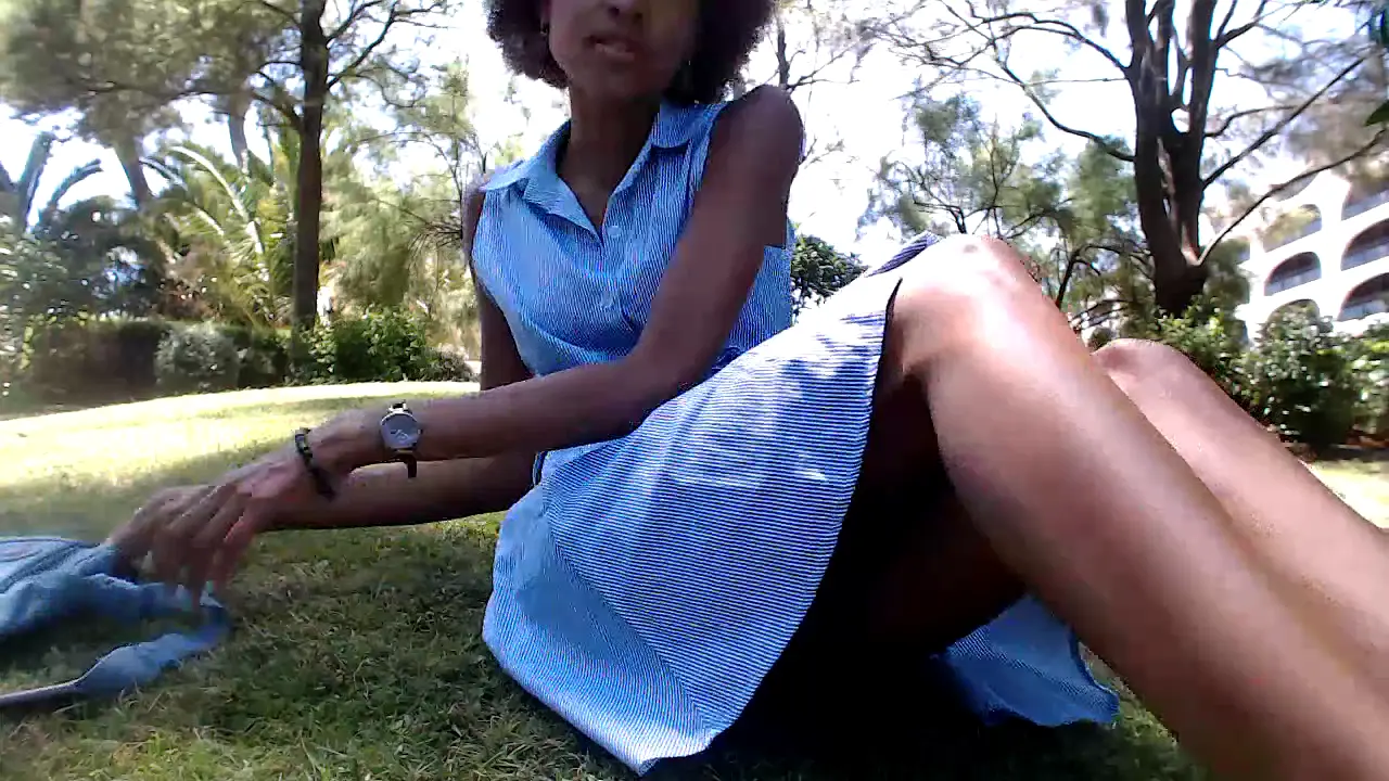 Curly-haired black girl fingers herself to orgasm in a public park