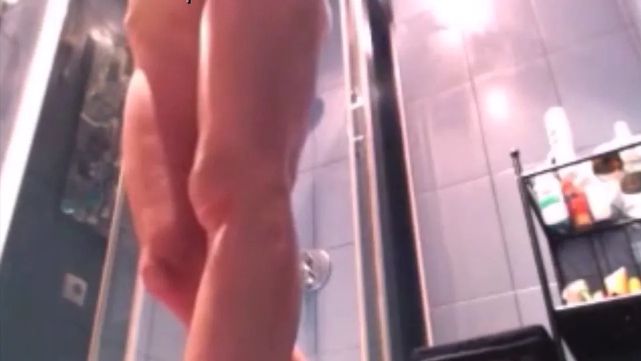 Amateur MILF strips and masturbates in the bathroom