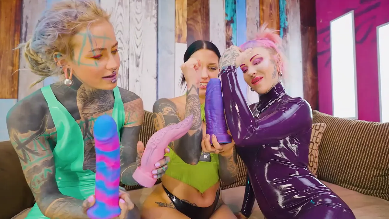 Goth chick Anuskatzz and Morea Black get gangbanged by two dommes using toys to make them