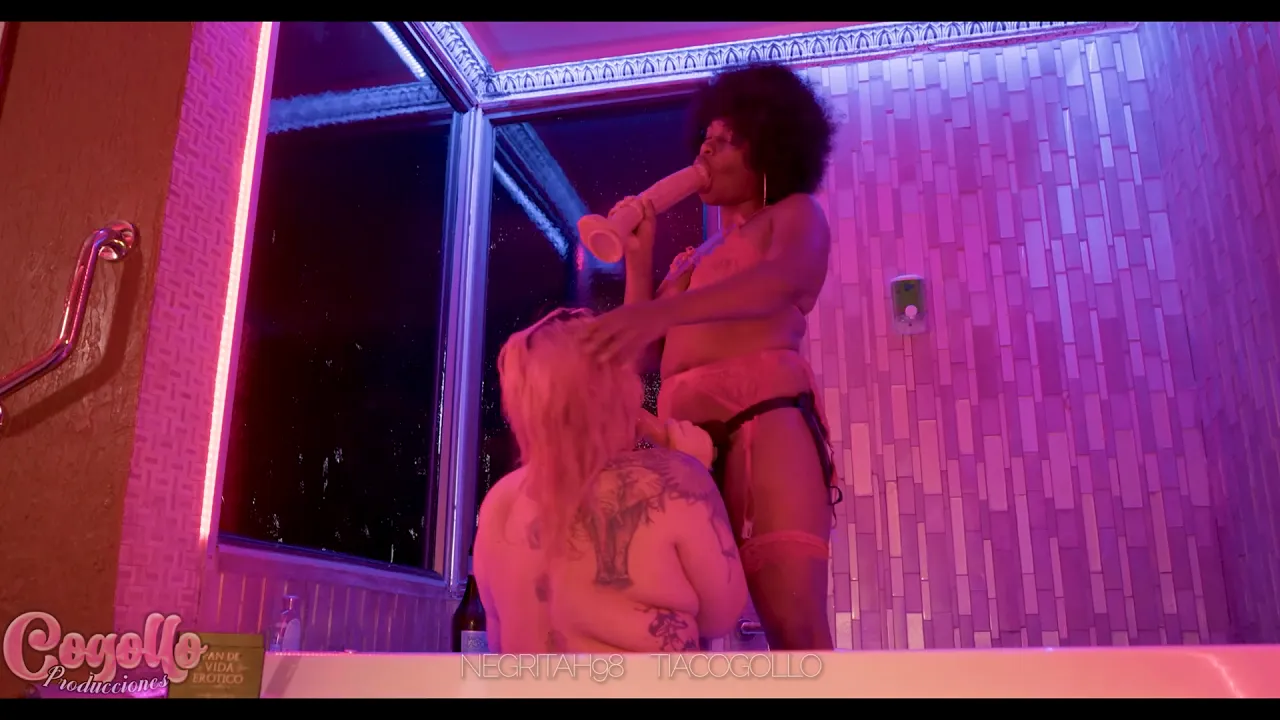Ebony goddess dominates her client with strap-on sex and toys in the jacuzzi