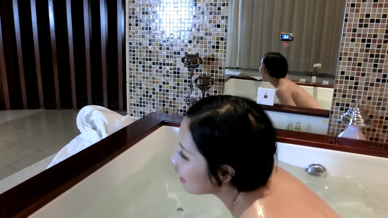 Petite Chinese webcam model strips naked and takes a bath, showing off her perfect