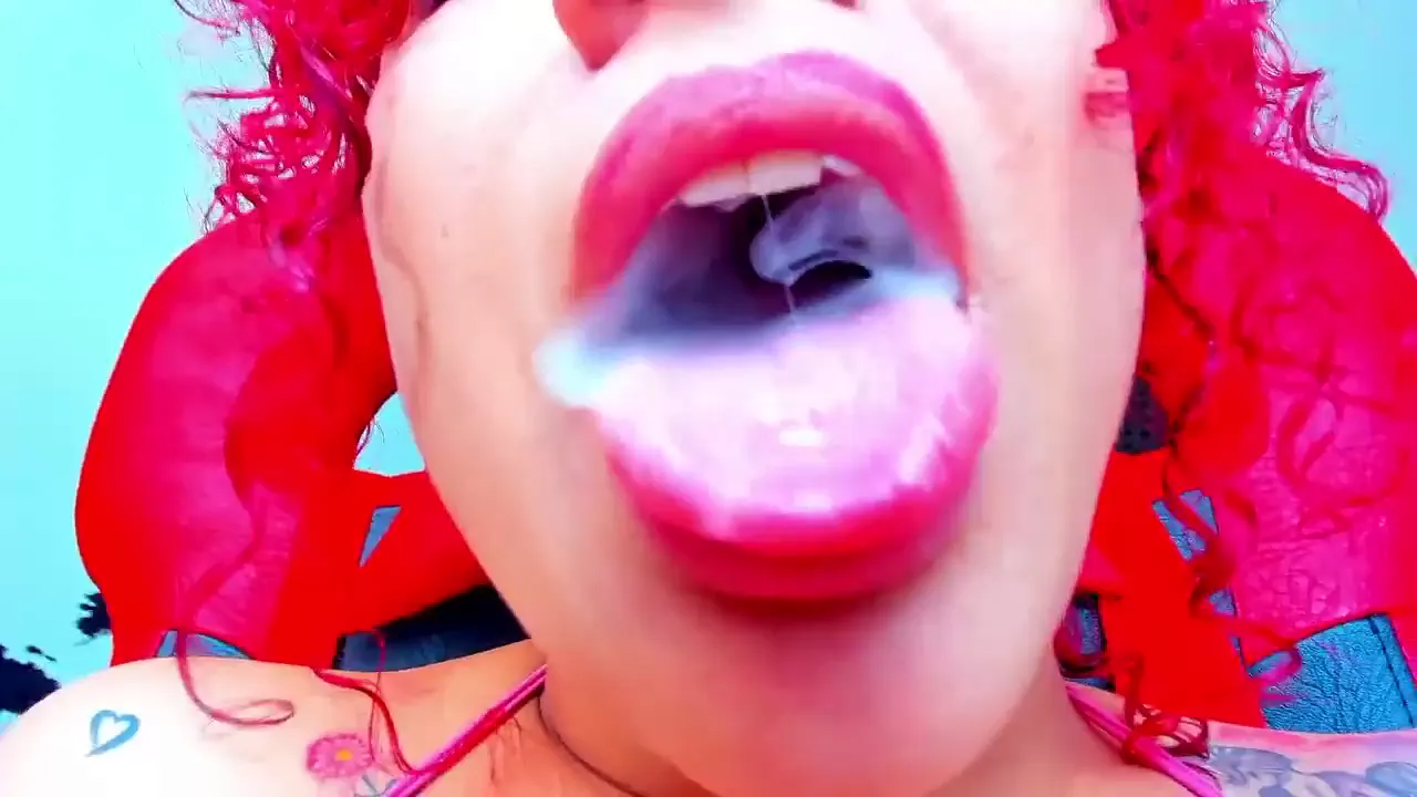 Amateur redhead masturbates and gives a blowjob while smoking a cigarette