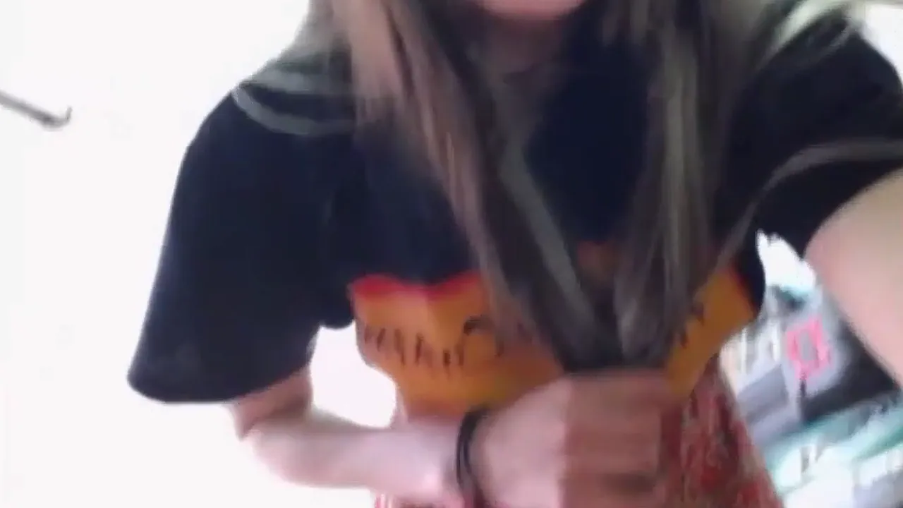Blonde amateur lifts her skirt and masturbates in public