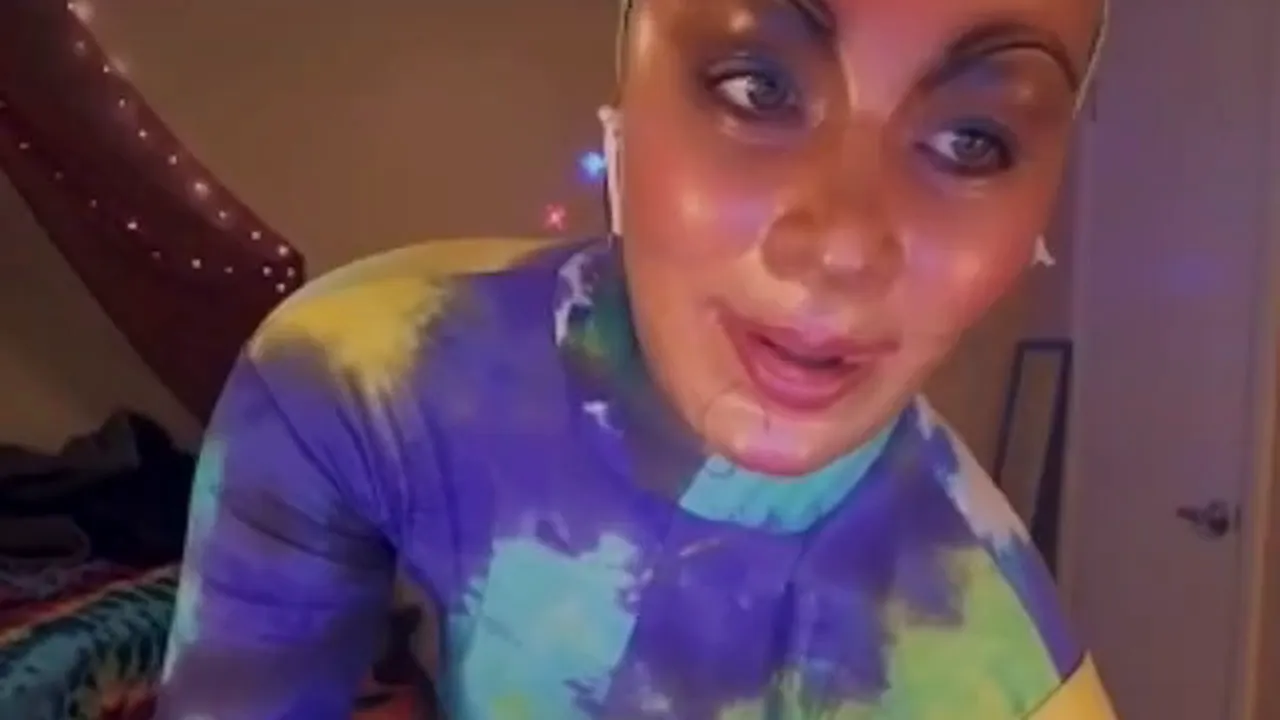 Webcam model Awesome Kate strips out of her fetish bodysuit and masturbates to music