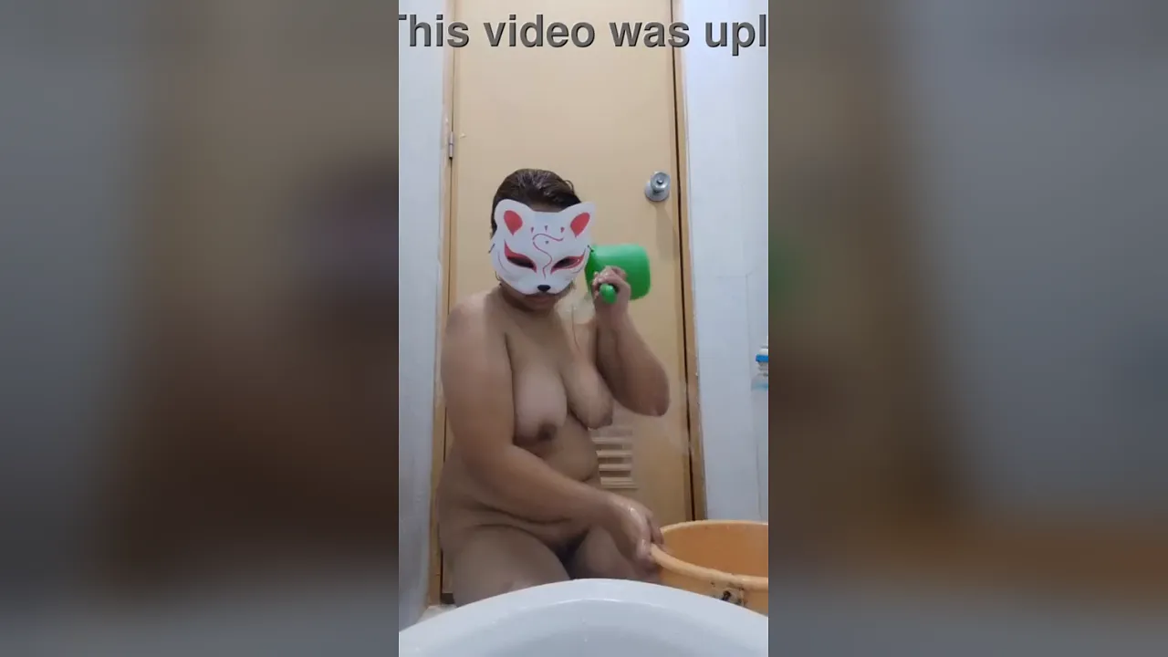 Sexyasianvidx soaps up her big natural tits and pussy in a homemade solo shower video