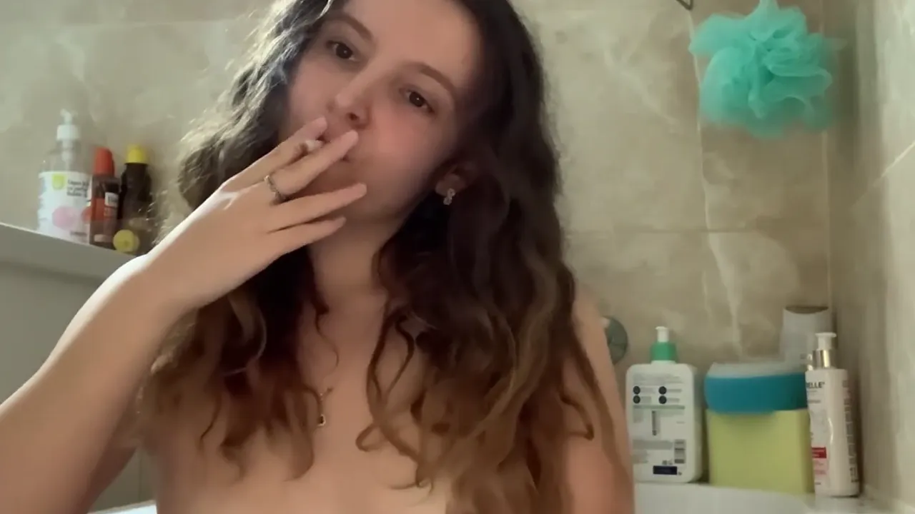 Brunette solo smoking fetish in the bathtub