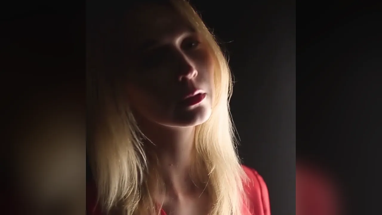 Red-dressed woman blows cock and fucks it doggystyle on the bed