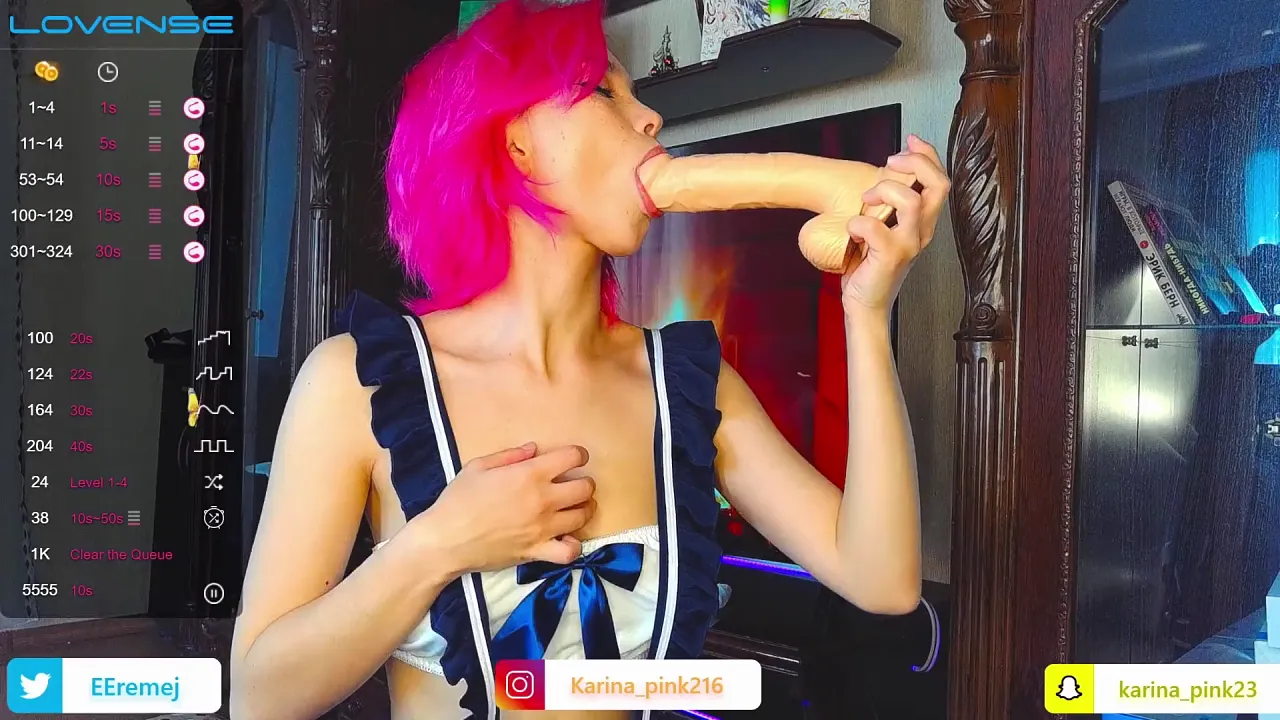 Petite redhead Lil Karina tries to fit a big dildo in her mouth for webcam blowjob