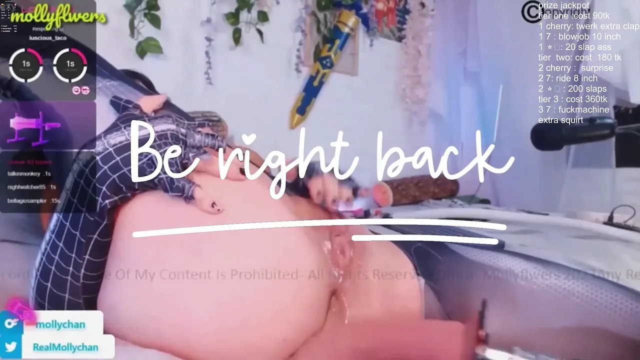 Mollyflwers cosplays a big-titted superheroine for webcam fans