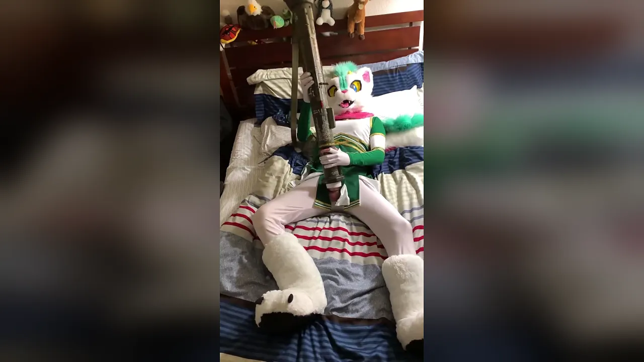 Cheerleader dragon girl masturbates with a gun-shaped toy