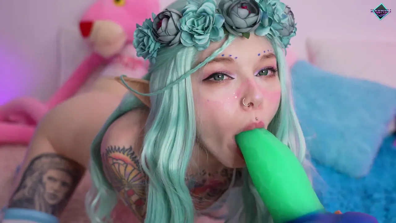 Tattooed fairy elf masturbates with a dragon toy and gives herself a deep blowjob