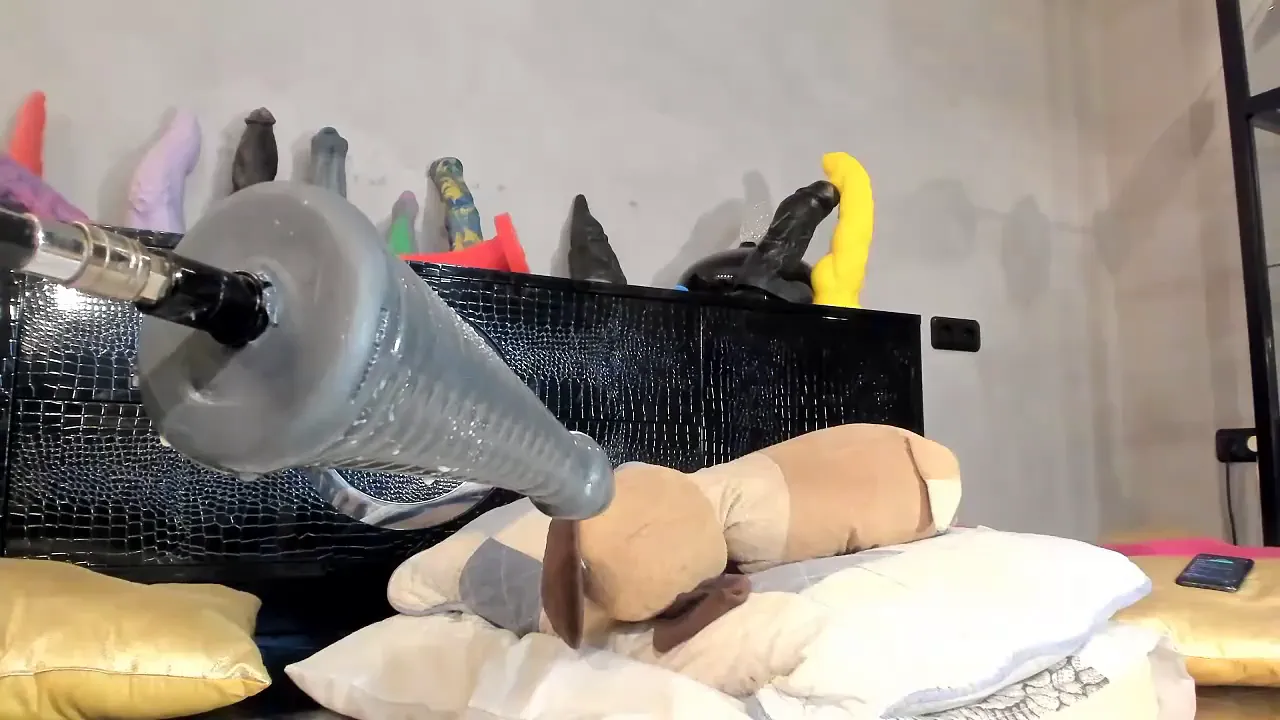 Solo blonde oilily fucks a machine with her dildo until she cums three times