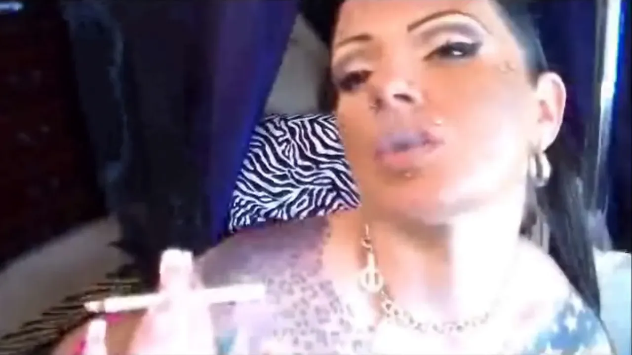 Erika Xstacy smokes a cigarette in her webcam solo