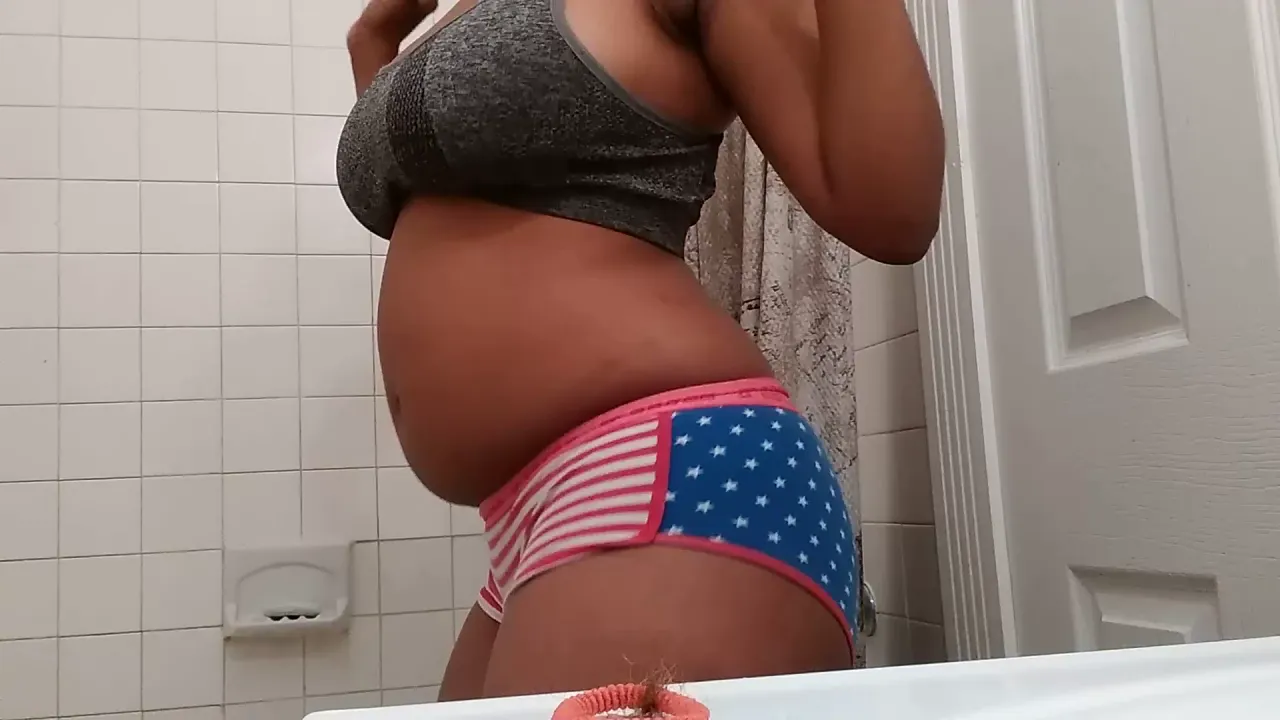 Ebony MILF strips and masturbates to orgasm in the shower