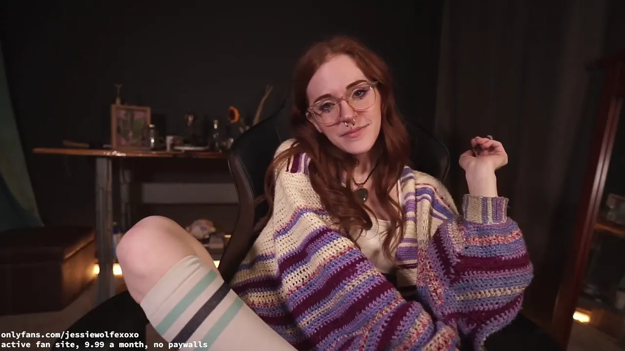 Auburn-haired girl with glasses smokes pot then masturbates with a vibrator