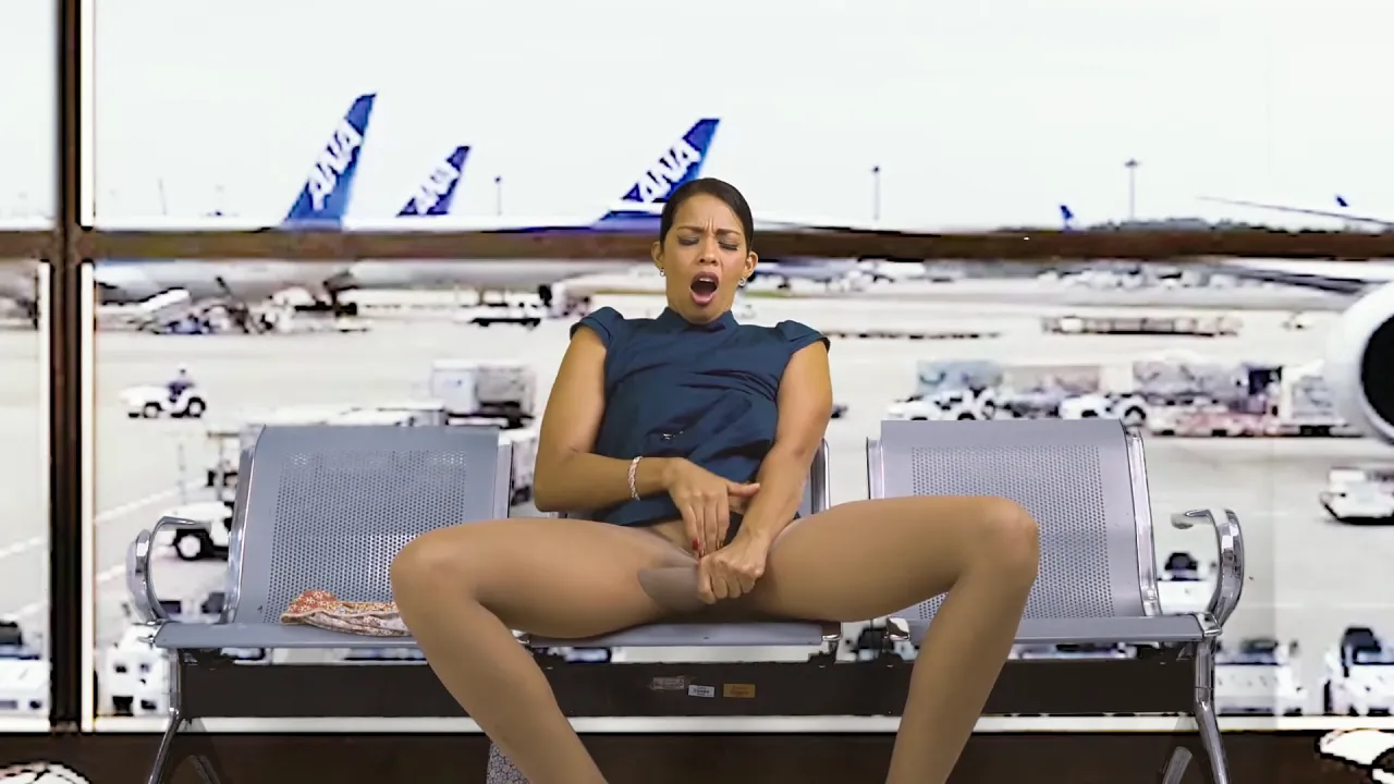 Mature stewardess masturbates to orgasm in public at the airport