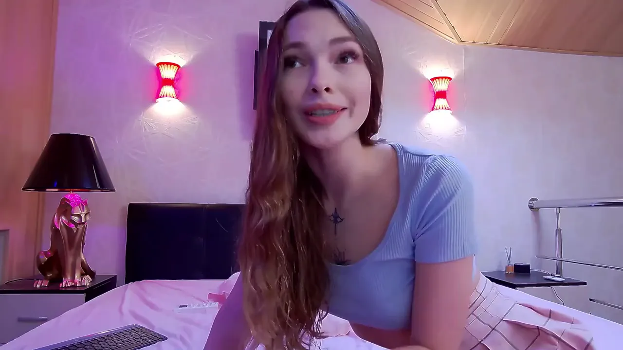 Young camgirl shows off her beautiful bald pussy and masturbates with a toy