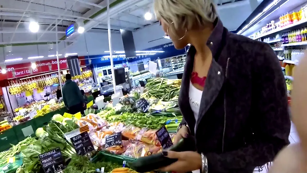 Pro performer Nicky Wayne fucks her pussy with a cucumber and an anal dildo in the kitchen