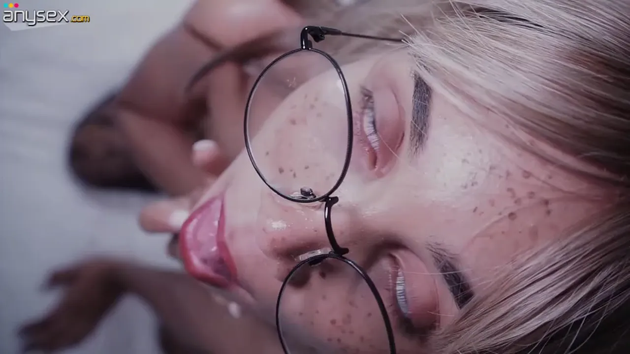 Blonde nerd with glasses and freckles masturbates in black stockings